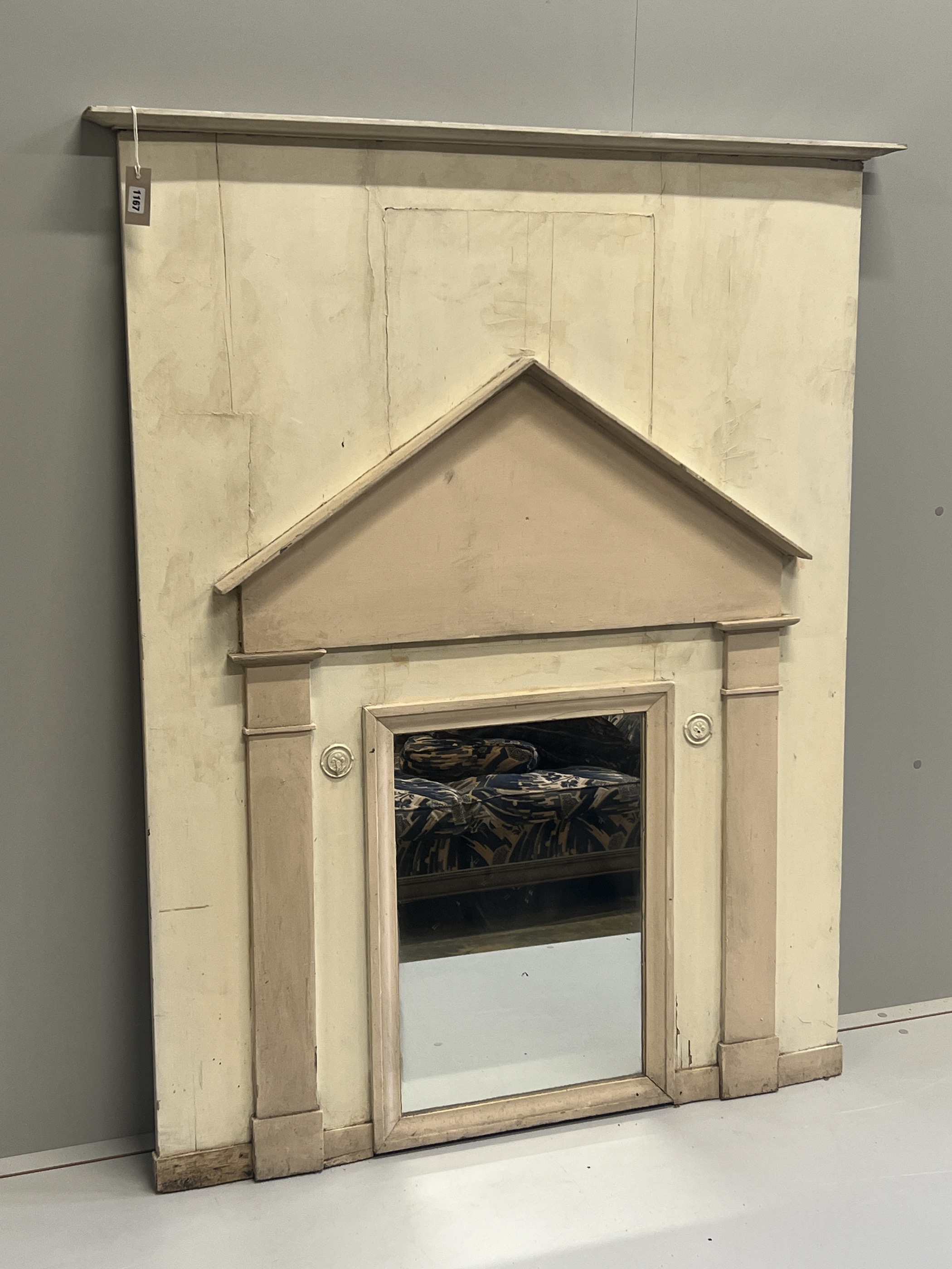 A late 18th/early 19th century French painted pine wall mirror modelled as an arched doorway, width 119cm, height 147cm